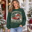 Female model wearing the Christmas Tree Farm sweatshirt
