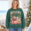 Female model wearing the Beachy Christmas sweatshirt