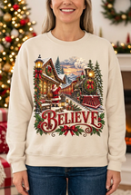 Female model wearing the Believe Christmas sweatshirt