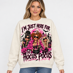 Female model wearing the cream Hocus Pocus sweatshirt