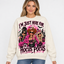 Female model wearing the cream Hocus Pocus sweatshirt