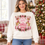 Female model wearing the Giddy Up holiday sweatshirt
